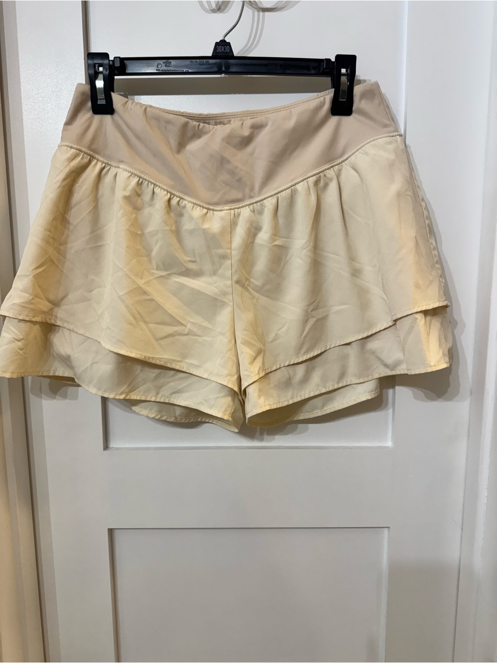Beige flowy running shorts